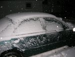 snowy car at
night